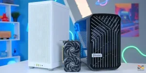 دو عدد کیس گیمینگ روی میز به همراه یک کارت گرافیک دو فن